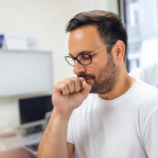 Man coughing showing how Breathing Non conditioned Inhaled air Through the Mouth affects asthma