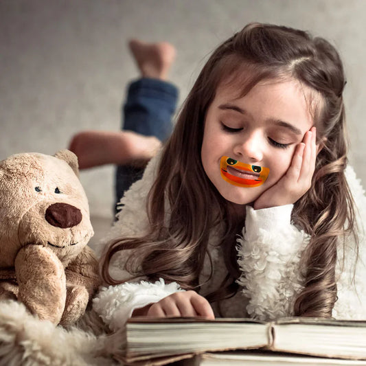Little girl with myotape for kids reading book showing why Nasal Breathing is Important for Children with Sleep Disordered Breathing