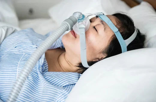 woman wearing anti-snoring chin strap. celebrities who did from sleep apnea