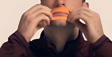 Apply - Tape to the upper and lower lip