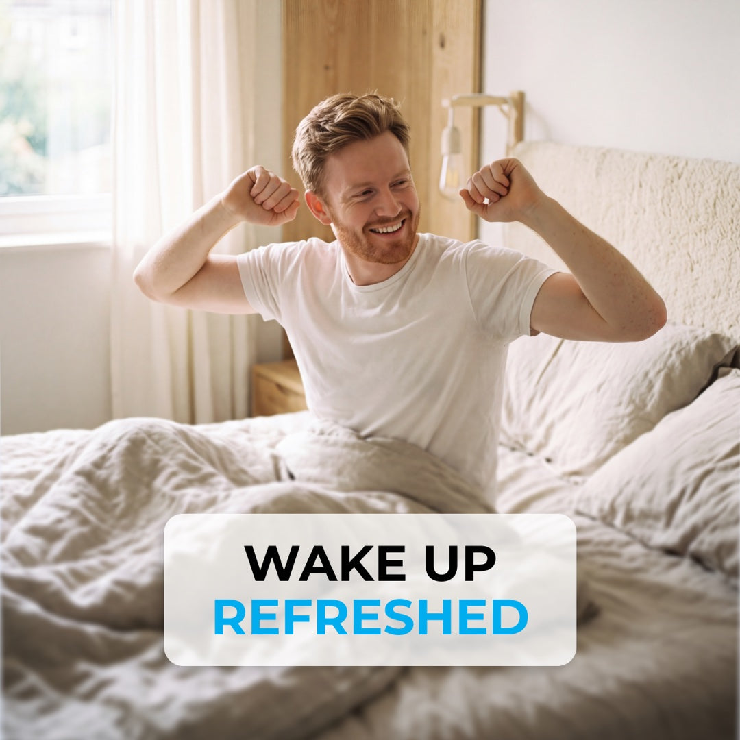 Man waking up refreshed in a bright bedroom